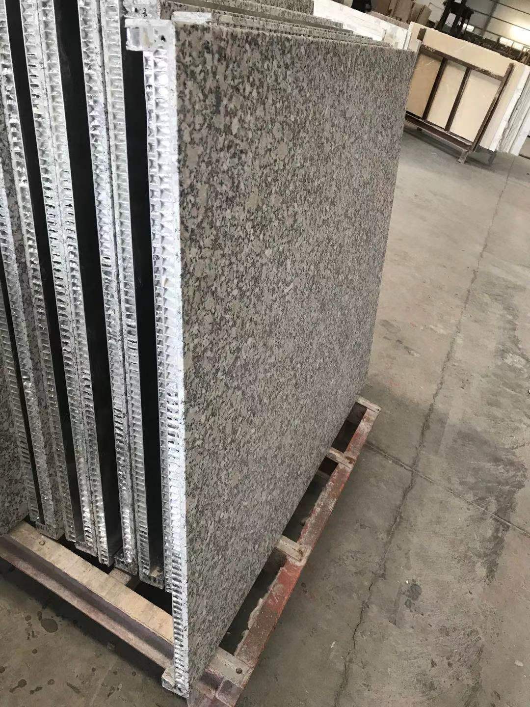 Granite honeycomb panels with bonded corners on an exterior